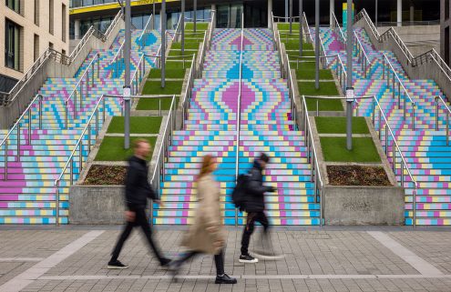 Artists daub the steps of Wembley Park in a joyful street mural for International Women’s Day